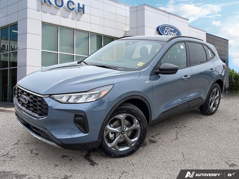 NEW 2025 Ford Escape ST-Line Hybrid - Vapor Blue Exterior / EBONY VINYL/ RED STITCHING Interior - $43,893 - Stock #E50102 - VIN 1FMCU9MZXSUA13070 - Photo 1