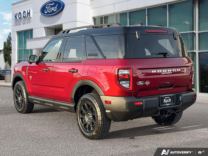 USED 2026 Ford Bronco Sport Badlands - Ruby Red Metallic Tinted Clearcoat Exterior / DARK SPACE GREY, LEATHER-TRIMMED FRONT SPORT CONTOUR BUCKET SEAT Interior - $49,959 - Stock #EP4825 - VIN 3FMCR9DA5TRE31427 - Photo 4