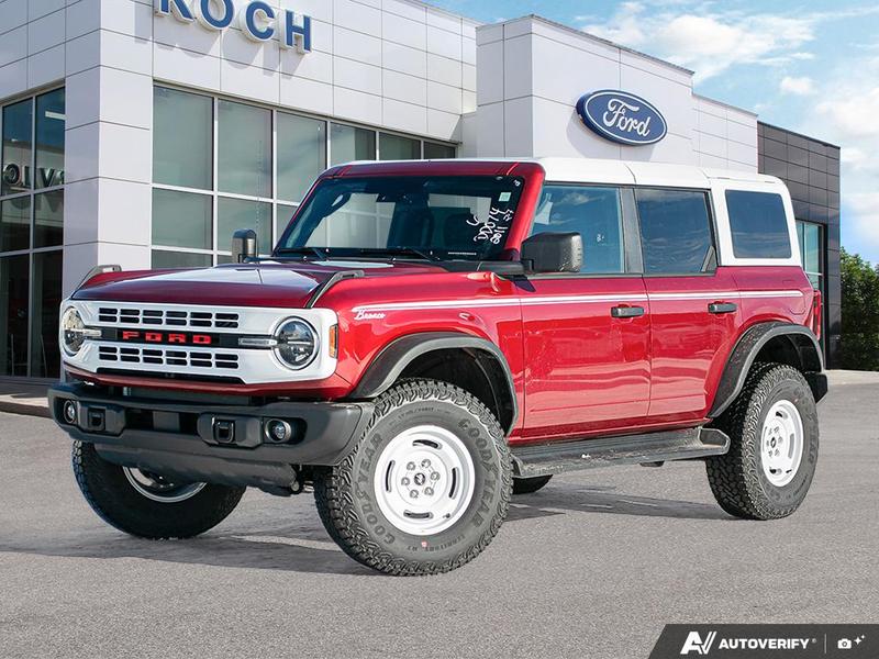 NEW 2026 Ford Bronco Heritage Edition - Ruby Red Tri-coat Metallic Exterior / BLACK ONYX-PLAID CLOTH NAVY PIER SEATS Interior - $76,259 - Stock #E60227 - VIN 1FMEE4DP9TLA42011 - Photo 1