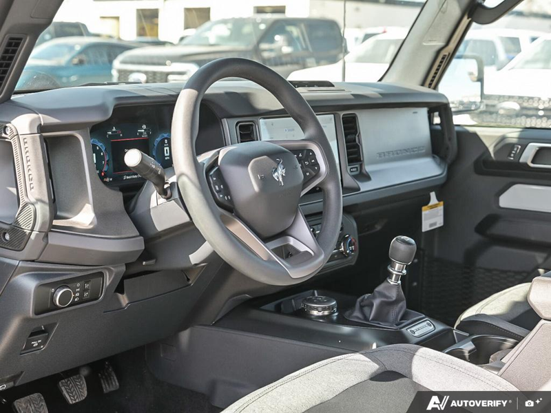 NEW 2026 Ford Bronco Base Sasquatch Manual - Avalanche Exterior / BLACK CLOTH GREY Interior - $61,356 - Stock #E60239 - VIN 1FMDE6AH1TLA43559 - Photo 13