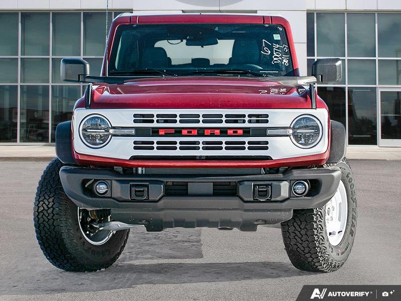 NEW 2026 Ford Bronco Heritage Edition - Ruby Red Tri-coat Metallic Exterior / BLACK ONYX-PLAID CLOTH NAVY PIER SEATS Interior - $76,259 - Stock #E60227 - VIN 1FMEE4DP9TLA42011 - Photo 2