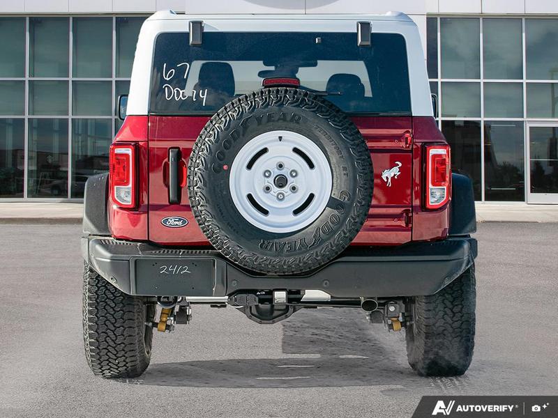 NEW 2026 Ford Bronco Heritage Edition - Ruby Red Tri-coat Metallic Exterior / BLACK ONYX-PLAID CLOTH NAVY PIER SEATS Interior - $76,259 - Stock #E60227 - VIN 1FMEE4DP9TLA42011 - Photo 5