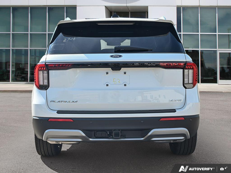 NEW 2026 Ford Explorer Platinum - Star White Tri-Coat Exterior / MOJAVE DUSK, PREM. LEATHER SEATING SURFACES SPORT CAPTAIN CHAIRS Interior - $64,348 - Stock #E61073 - VIN 1FMUK8HHXTGC46954 - Photo 5