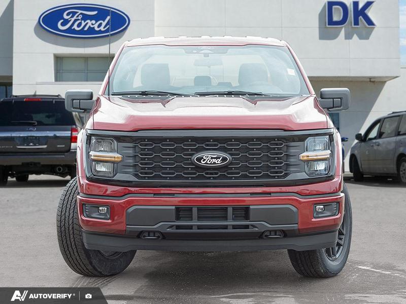 NEW 2026 Ford F-150 STX - Ruby Red Tri-coat Metallic Exterior / BLACK ONYX/BLUE PREM LEATHER SEATS Interior - $59,999 - Stock #D60325 - VIN 1FTEW2LP6TKD58575 - Photo 2