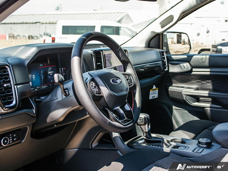 NEW 2026 Ford Ranger XLT - Oxford White Exterior / EBONY PREMIUM CLOTH Interior - $56,913 - Stock #E60298 - VIN 1FTER4HP4TLE04295 - Photo 13