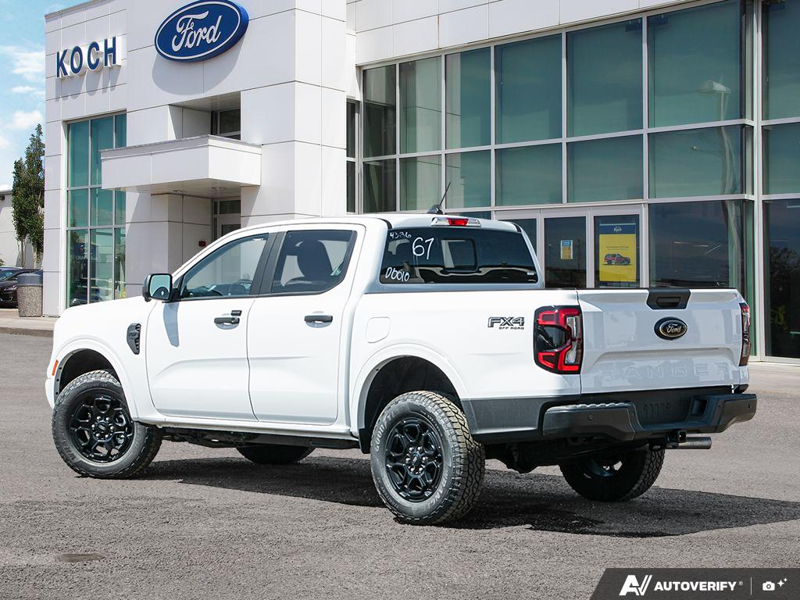 NEW 2026 Ford Ranger XLT - Oxford White Exterior / EBONY PREMIUM CLOTH Interior - $56,913 - Stock #E60298 - VIN 1FTER4HP4TLE04295 - Photo 4